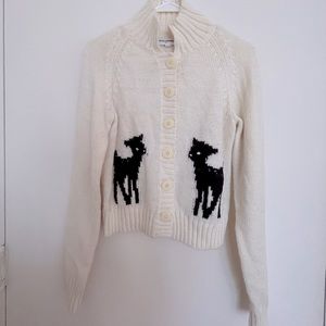 White sweater with deer pattern